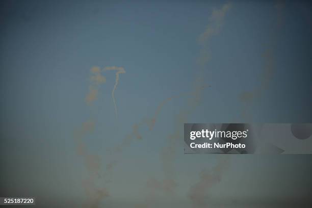 Smoke trails are seen as rockets are launched from the Gaza Strip towards Israel August 20, 2014.Abu Ubaida, the spokesman of the Izz el-Deen...
