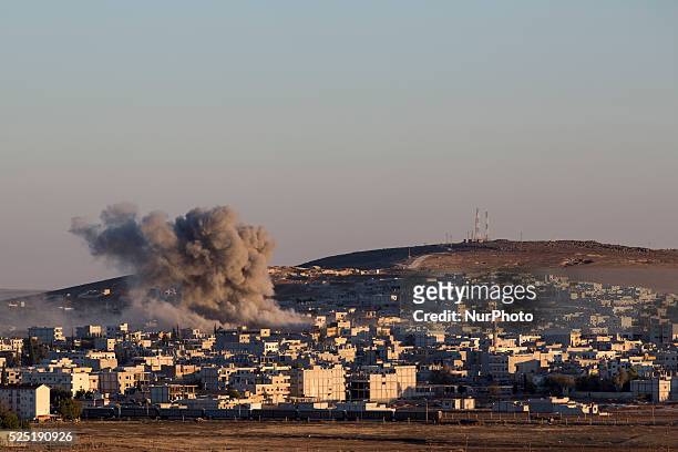 Airstrike on the city of Kobani, Syria on Oct. 21, 2014. The US has been providing air strikes to assists Kurdish PYG fighters battling Islamic State...