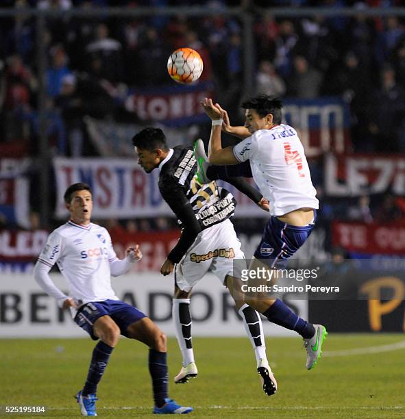 Jorge Fucile of Nacional and Lucca of Corinthians jump for the ball during a match between Nacional and Corinthians as part of Copa Libertadores 2016...