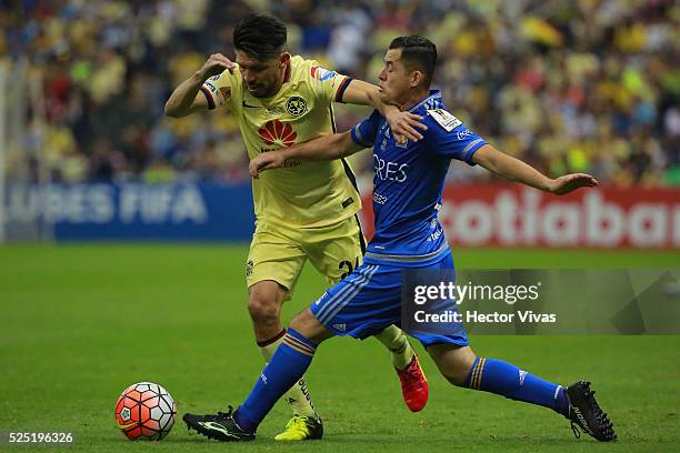 Israel Jimenez of Tigres struggles for the ball with Oribe Peralta of America during the Final second leg match between America and Tigres UANL as...