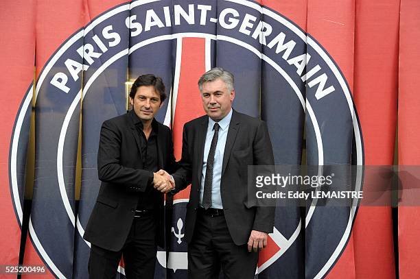 Leonardo Nascimento de Araujo general manager and Carlo Ancelotti, new head coach of Paris Saint Germain FC pose during the press conference at Parc...