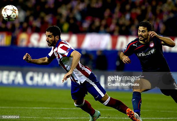 Atletico de Madrid's Spanish midfielder Raul Garcia and Olympiacos Spanish Defender Alberto Botia during the Champions League 2014/15 match between...