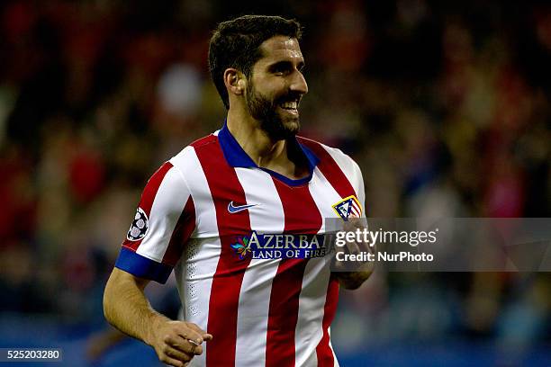 Atletico de Madrid's Spanish midfielder Raul Garcia celebrates a goal during the Champions League 2014/15 match between Atletico de Madrid and...