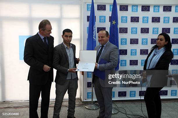 Director of UNRWA operations, Robert Turner, and European Union representative John Gatt-Rutter, attend a photo gallery organized by the Relief and...