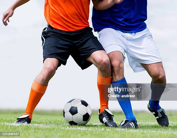 men playing football - fault sports stock pictures, royalty-free photos & images