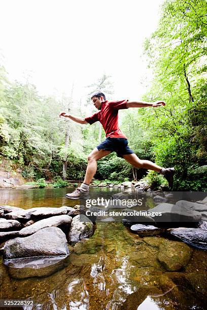 Rock Ruff Jumping 3,243 Man Jumping From Some Rocks Stock Photos, High-Res Pictures, and ...