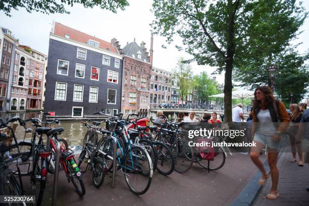 at gracht and canal in amsterdam - gracht amsterdam stockfoto's en -beelden