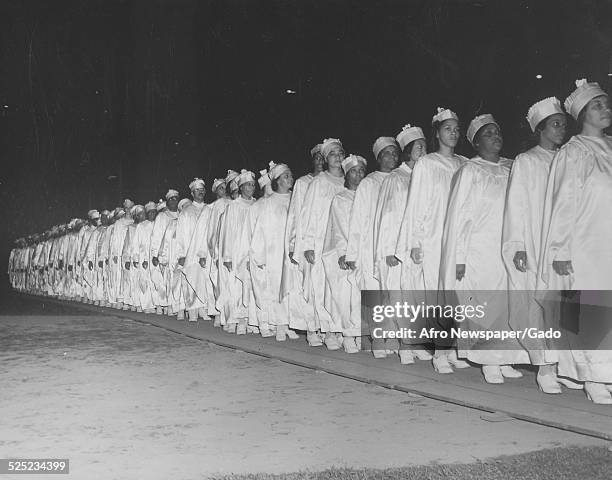 African-American Christian evangelist, faith healer, television personality and entrepreneur Lightfoot Solomon Michaux and converts, 1946.