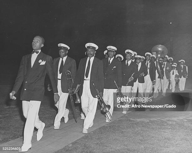 African-American Christian evangelist, faith healer, television personality and entrepreneur Lightfoot Solomon Michaux and marching band, 1960.