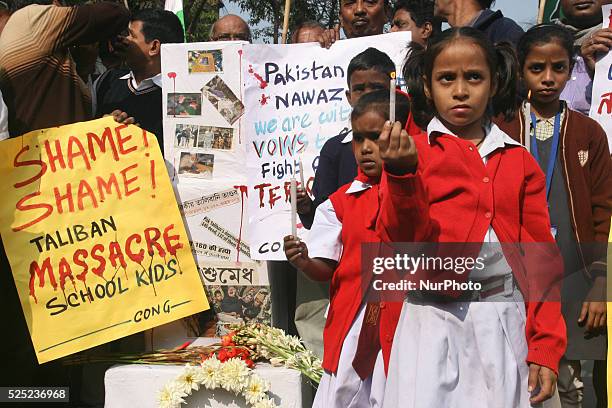 School Students hold candle vigil and South Kolkata Indian National Congress party organized a condemn pray in Kolkata, India, on December 17, 2014...