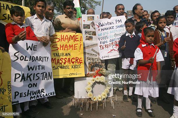 School Students hold candle vigil and South Kolkata Indian National Congress party organized a condemn pray in Kolkata, India, on December 17, 2014...