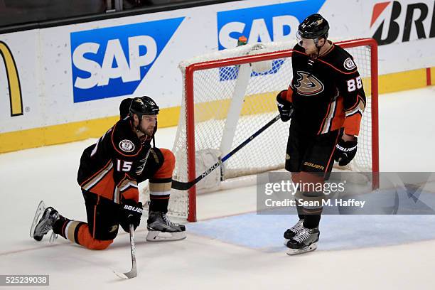 Ryan Getzlaf is tapped by Jamie McGinn of the Anaheim Ducks after losing to the Nashville Predators 2-1 in Game Seven of the Western Conference First...