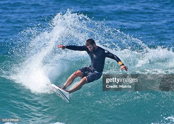 Chris Hemsworth is seen surfing and relaxing at the beach on April 28, 2016 in Byron Bay, Australia.