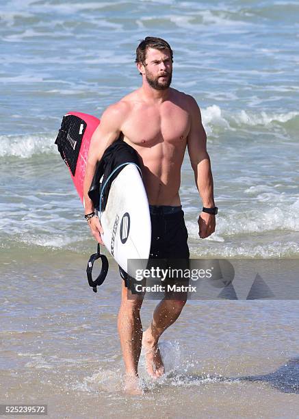 Chris Hemsworth is seen surfing and relaxing at the beach on April 28, 2016 in Byron Bay, Australia.