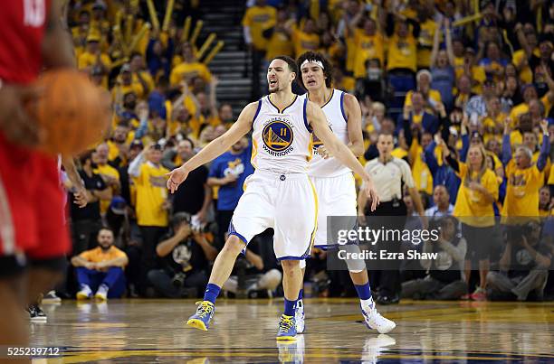 Klay Thompson of the Golden State Warriors and Anderson Varejao of the Golden State Warriors celebrate after Thompson made a three-point basket...