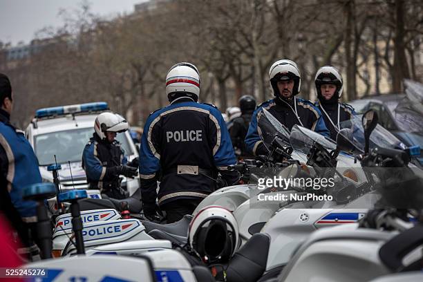 Ambulances and police officers gather in front of the offices of the French satirical newspaper Charlie Hebdo on January 7, 2015 in Paris, France....