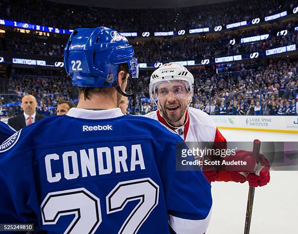 Erik Condra of the Tampa Bay Lightning shakes the hand of Pavel Datsyuk of the Detroit Red Wings after Game Five of the Eastern Conference First...