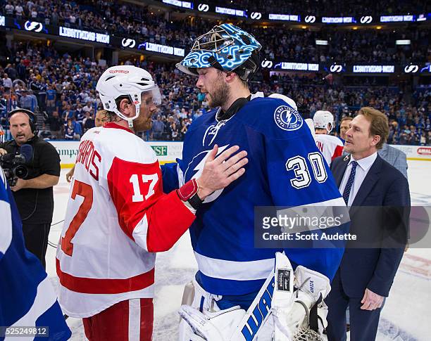 Goalie Ben Bishop of the Tampa Bay Lightning shakes the hand of Brad Richards of the Detroit Red Wings after Game Five of the Eastern Conference...