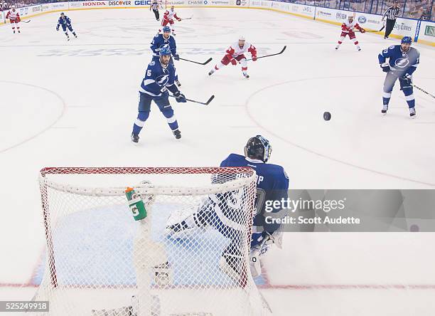 Goalie Ben Bishop of the Tampa Bay Lightning makes a save against the Detroit Red Wings during the third period of Game Five of the Eastern...