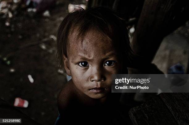 Chong Kneas, Tonle Sap, Cambodia. Poverty and unsanitary living circumstances are rife in isolated communities that live their lives on the lake. A...