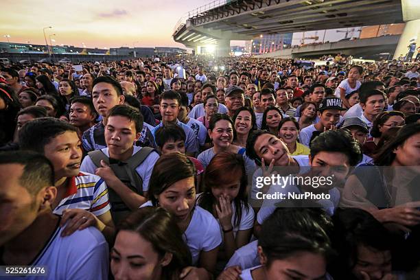 People wait for the arrival of Pope in Manila, Philippines on Thursday, January 15, 2015. Pope Francis arrived in the Philippines on January 15 for a...