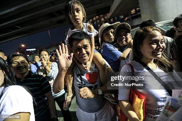 People wait for the arrival of Pope in Manila, Philippines on Thursday, January 15, 2015. Pope Francis arrived in the Philippines on January 15 for a...