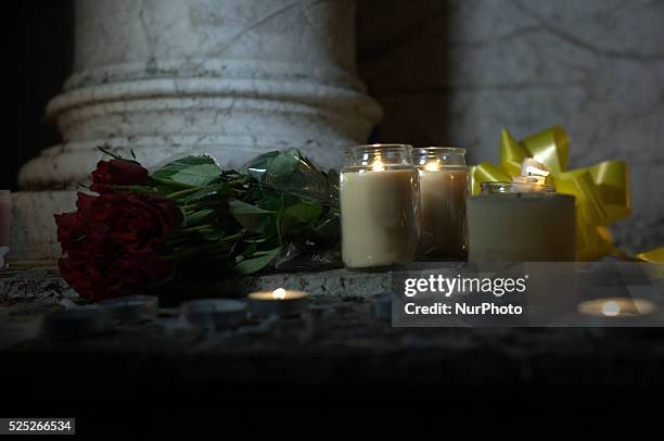 Roses, candles and a yellow ribbon being laid on a statue in remebrance of Alan Henning on October 5, 2014 in Manchester, England. A video purporting...