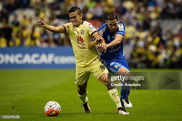 Andres Andrade of Club America struggles for the ball with Jesus Duenas of Tigres during the second leg of the final match of the CONCACAF Champions...