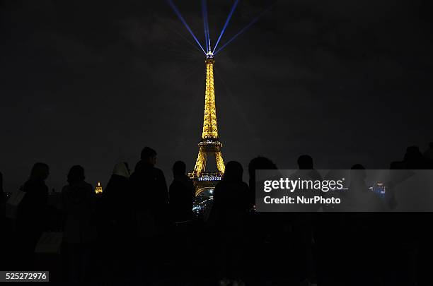 People looking at the Eifel Tower from the Trocadero place in Paris, France, on December 11, 2015