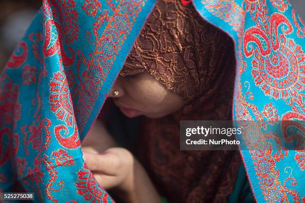 Bangladeshi Muslim devotees board trains after attending the Akheri Munajat concluding prayers on the third day of Biswa Ijtema, the second largest...