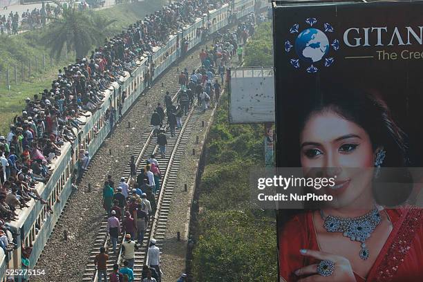 Bangladeshi Muslim devotees board trains after attending the Akheri Munajat concluding prayers on the third day of Biswa Ijtema, the second largest...