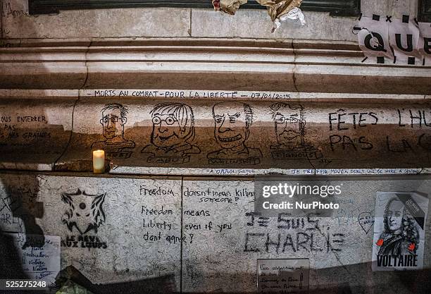 People gather to light candles and write on the Place De La Republic, during a Unity rally &quot;Marche Republicaine&quot; on January 11, 2015 in...