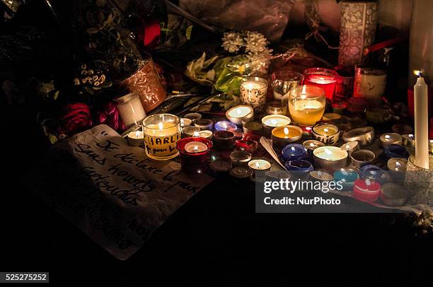 People gather to light candles and write on the Place De La Republic, during a Unity rally &quot;Marche Republicaine&quot; on January 11, 2015 in...