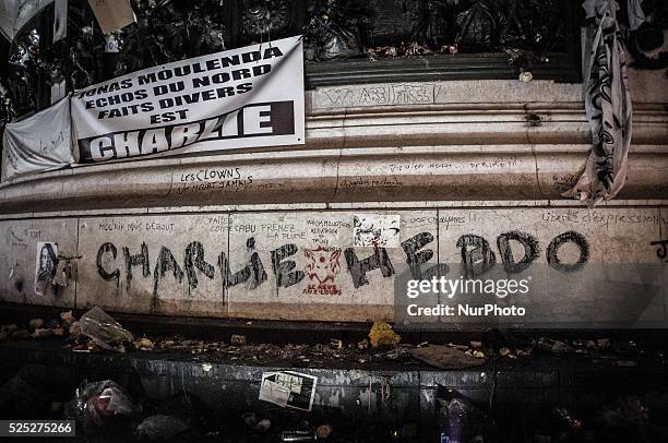 People gather to light candles and write on the Place De La Republic, during a Unity rally &quot;Marche Republicaine&quot; on January 11, 2015 in...