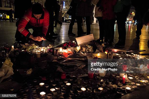 People gather to light candles and write on the Place De La Republic, during a Unity rally &quot;Marche Republicaine&quot; on January 11, 2015 in...