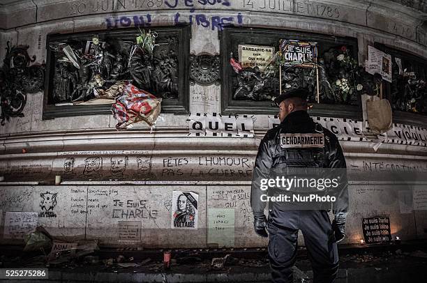 People gather to light candles and write on the Place De La Republic, during a Unity rally &quot;Marche Republicaine&quot; on January 11, 2015 in...