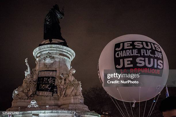 People gather to light candles and write on the Place De La Republic, during a Unity rally &quot;Marche Republicaine&quot; on January 11, 2015 in...