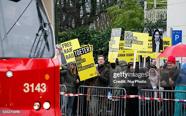 Participants during a protest organized by Amnesty International, for the immediate release of the Saudi blogger Raif Badawi, in front of the Saudi...