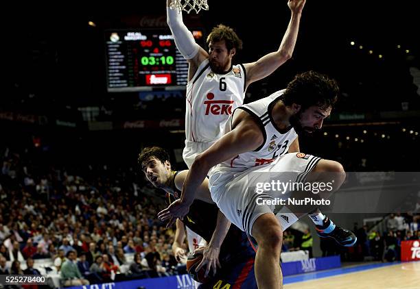 Real Madrid's Spanish player Sergio Llull and Barcelonas Croatian player Ante Tomic during the Basket Euroleague 2014/15 match between Real Madrid...