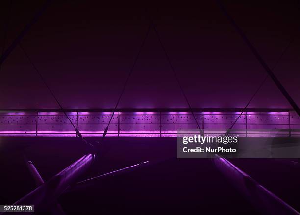 Foggy night view of the Father Bernatka Footbridge on 29th October 2014 in Krakow. Krakow's Father Bernatka Footbridge is a footbridge for...
