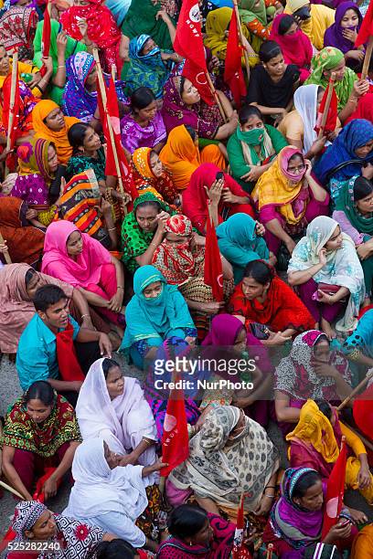 Workers of Hamim Sportswear LTD take part in a demonstration in front of National Press Club in Dhaka, following the closure of their factory. The...