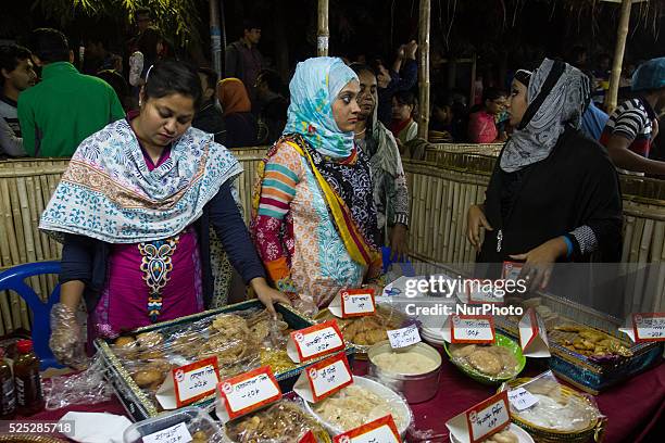 Pitha makers from all over the city gathered to sell their traditional pithas in Dhaka, Bangladesh, on January 9, 2015.