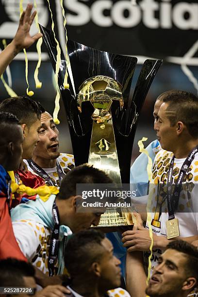 Players of Club America celebrate with trophy after defeating Tigres in the 2015-16 CONCACAF Champions League final at the Aztec Stadium in Mexico...