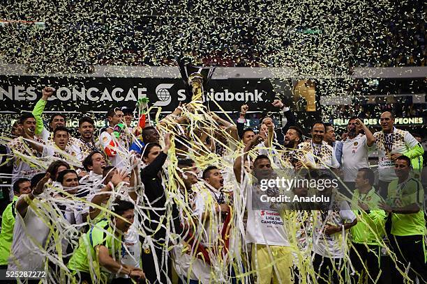 Players of Club America celebrate with trophy after defeating Tigres in the 2015-16 CONCACAF Champions League final at the Aztec Stadium in Mexico...