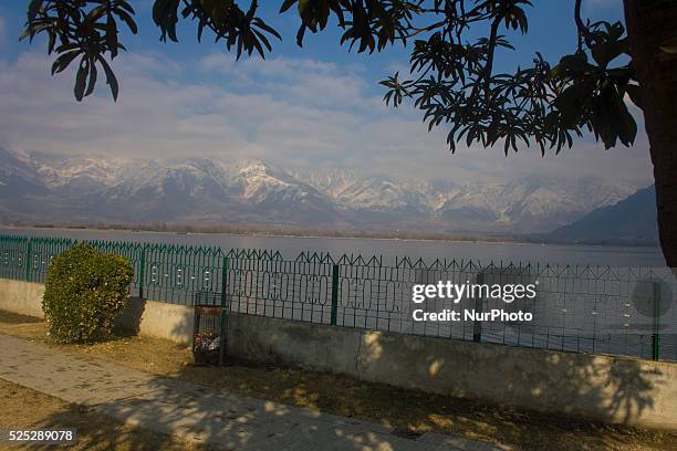 Snow capped Zabarvan mountains are reflected on the waters of Dal lake in Srinagar, the summer capital of Indian administered Kashmir State, India on...