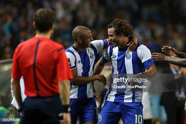 Porto's Itaian forward Pablo Osvaldo celebrates after scoring goal with teammate Porto's Algerian forward Yacine Brahimi during the Premier League...