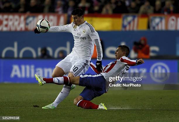 Atletico de Madrid's Uruguayan Defender Jose Maria Gimenez and Real Madrid's Colombian midfielder James Rodriguez during the Spanish Kings cup...