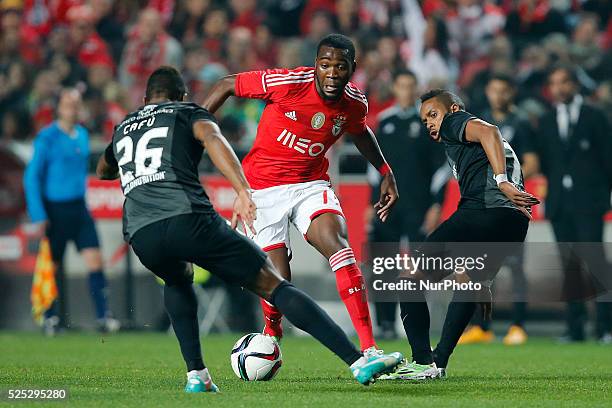 Benfica's forward Ola John vies for the ball with Guimaraes's forward Cafu and Guimaraes's forward Hernani during the Portuguese League football...