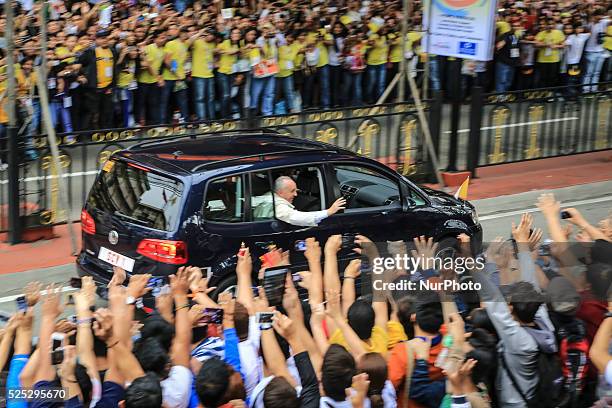 Pope Francis waves to the crowd after conducting mass in Manila on January 18, 201. Pope Francis is visiting venues across Leyte and Manila during...