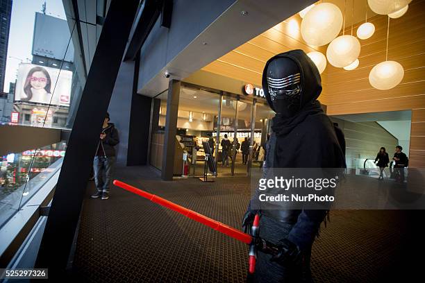 Fans of Star Wars wearing Star Wars costume go to the cinema to watch the new movie, Star Wars, The Force Awakens, in Shinjuku cinemas, Tokyo, on...